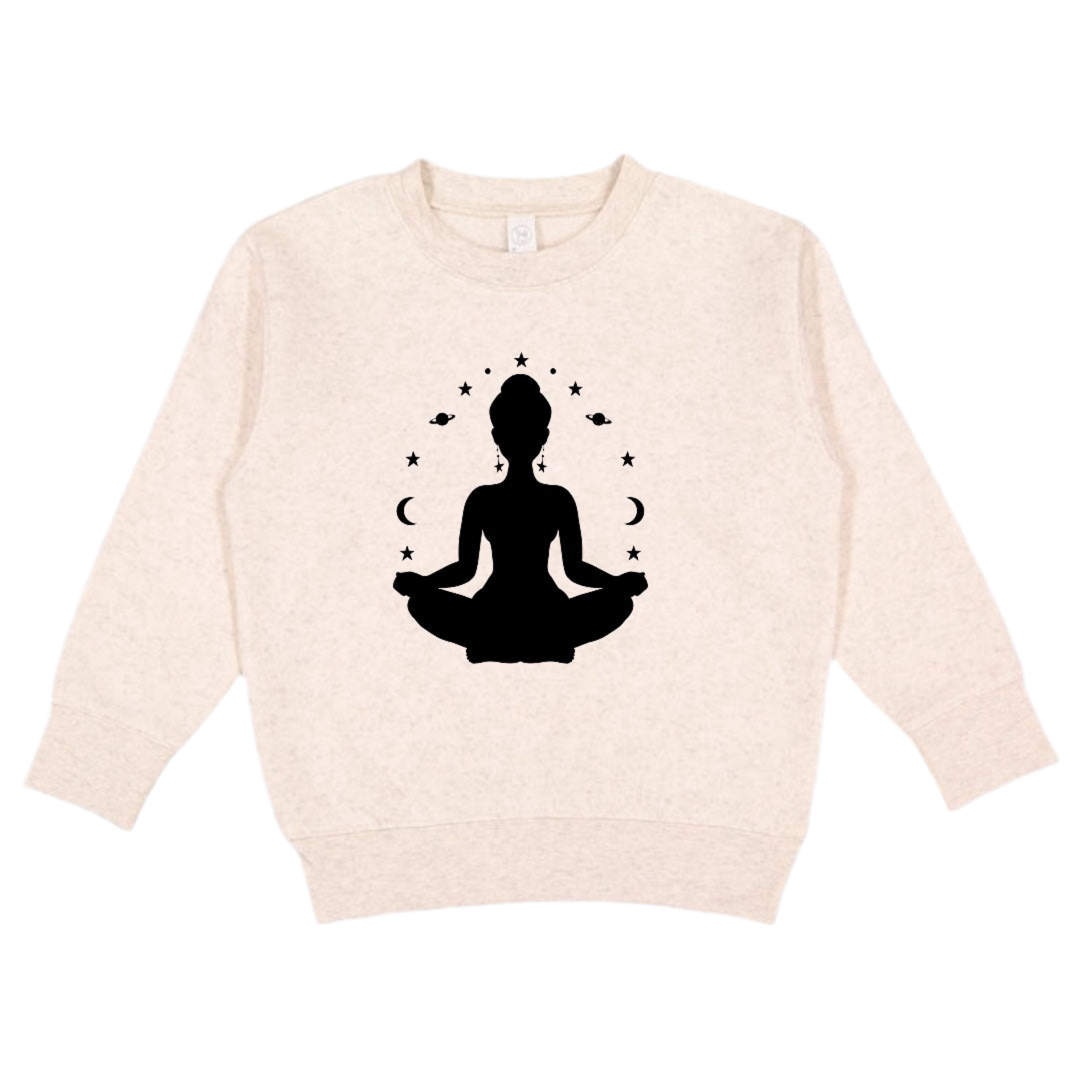 Beige sweatshirt with a black silhouette of a person in a meditative pose on a white background