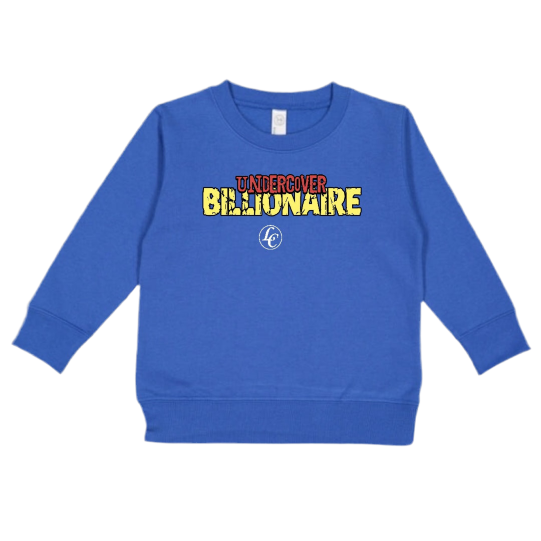 Blue sweatshirt with colorful text 'Undercover Billionaire' on a white background
