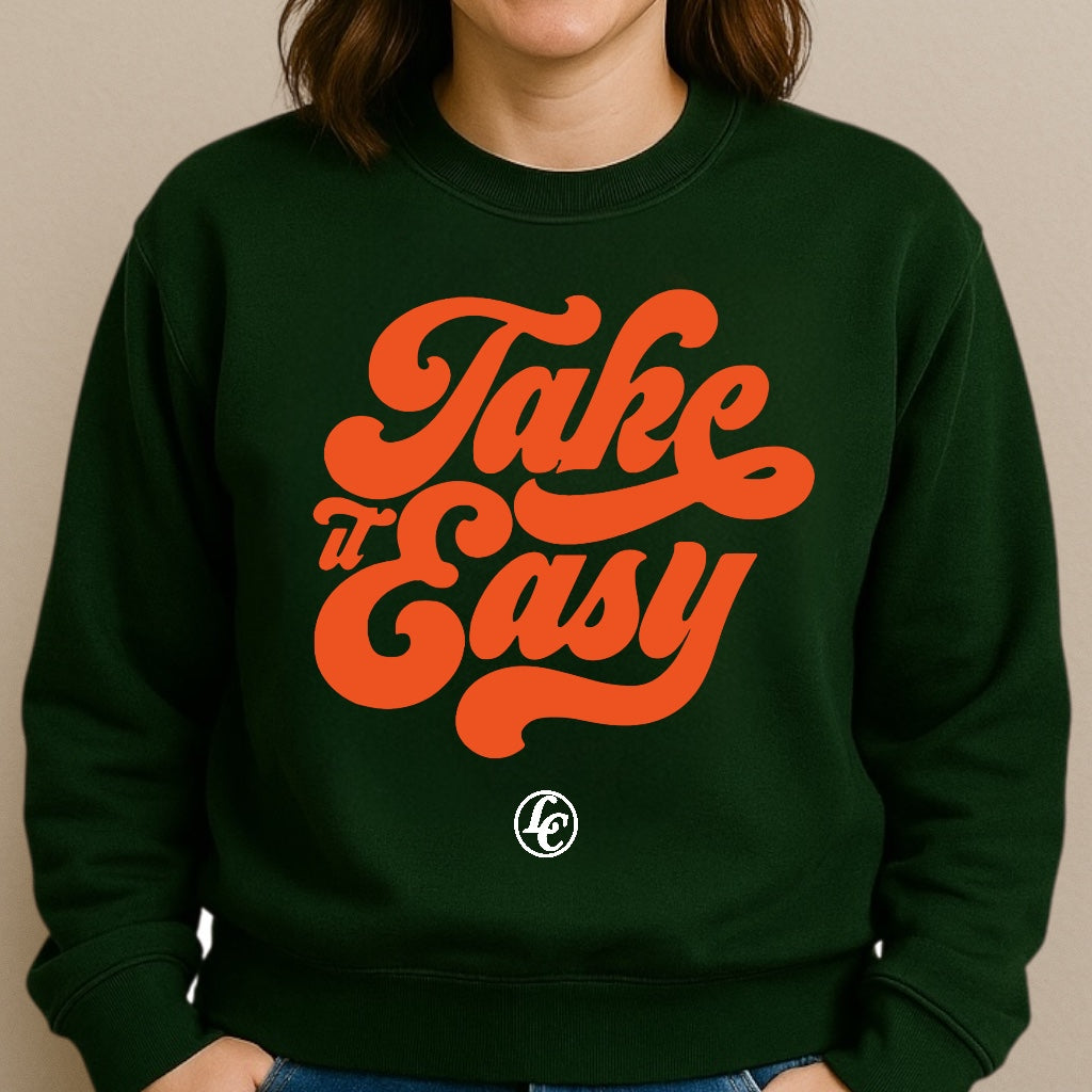 Green sweatshirt with 'Take It Easy' in orange text on a beige background