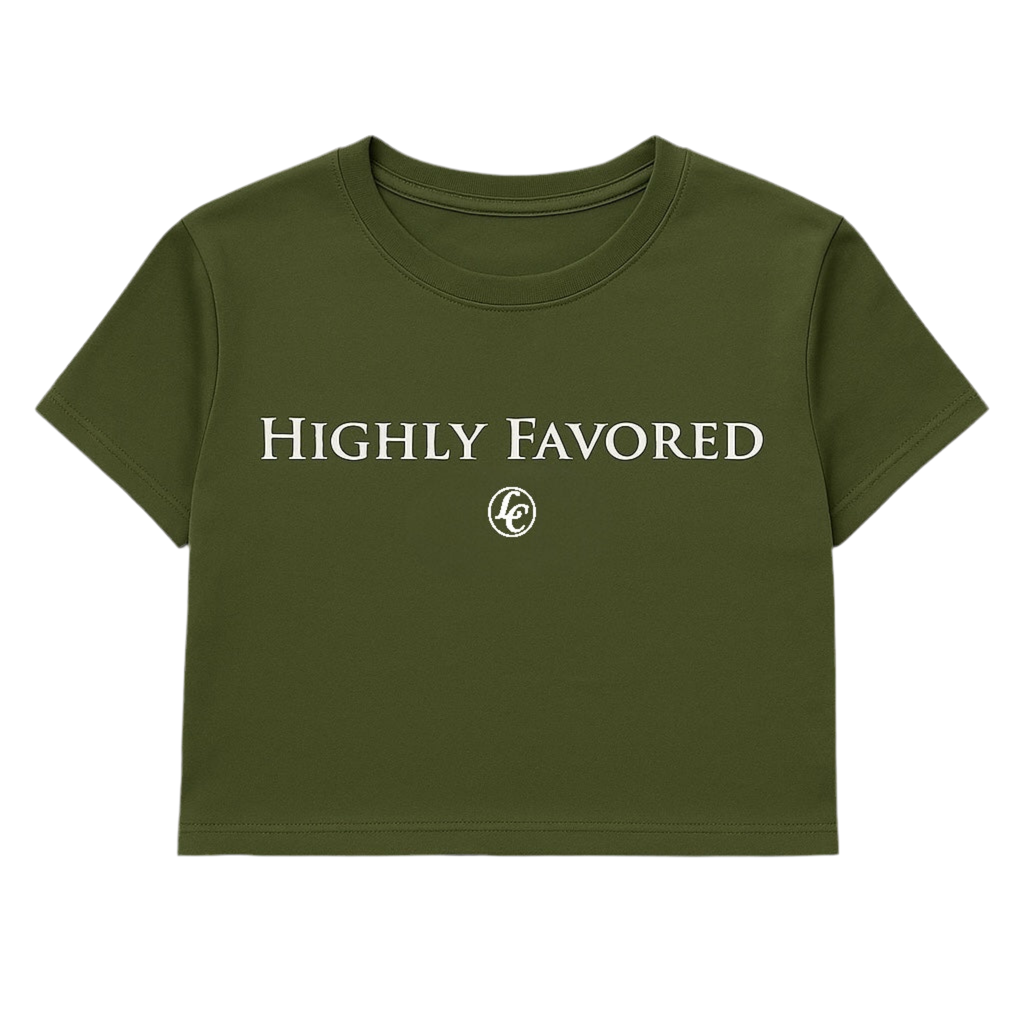 Green t-shirt with 'HIGHLY FAVORED' text on a white background