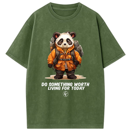 Green t-shirt with a panda wearing an orange jacket and backpack, and text 'Do something worth living for today'.