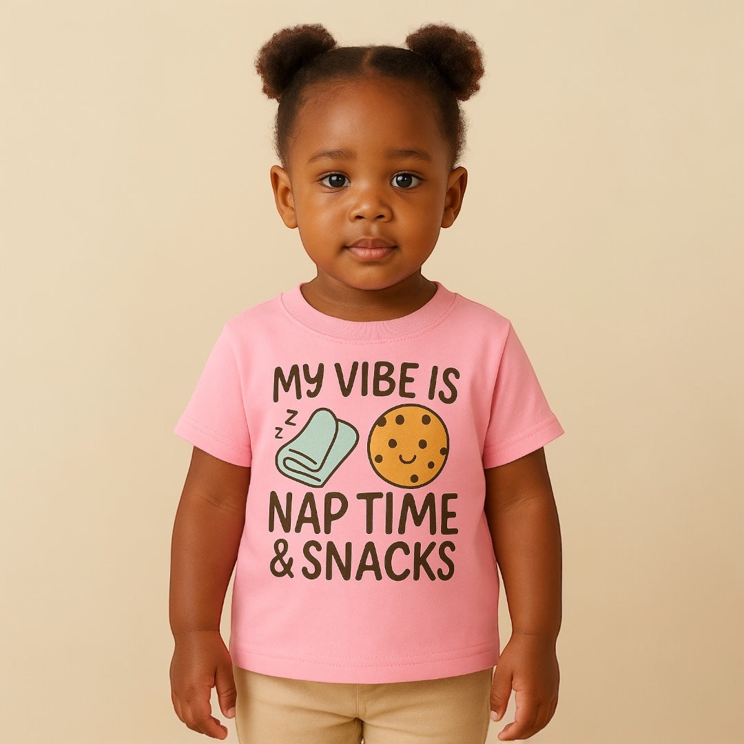 Child wearing a pink t-shirt with text and graphics on a beige background