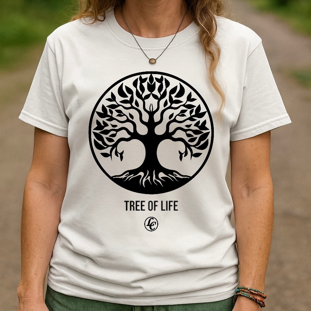 Person wearing a white t-shirt with a 'Tree of Life' design outdoors.