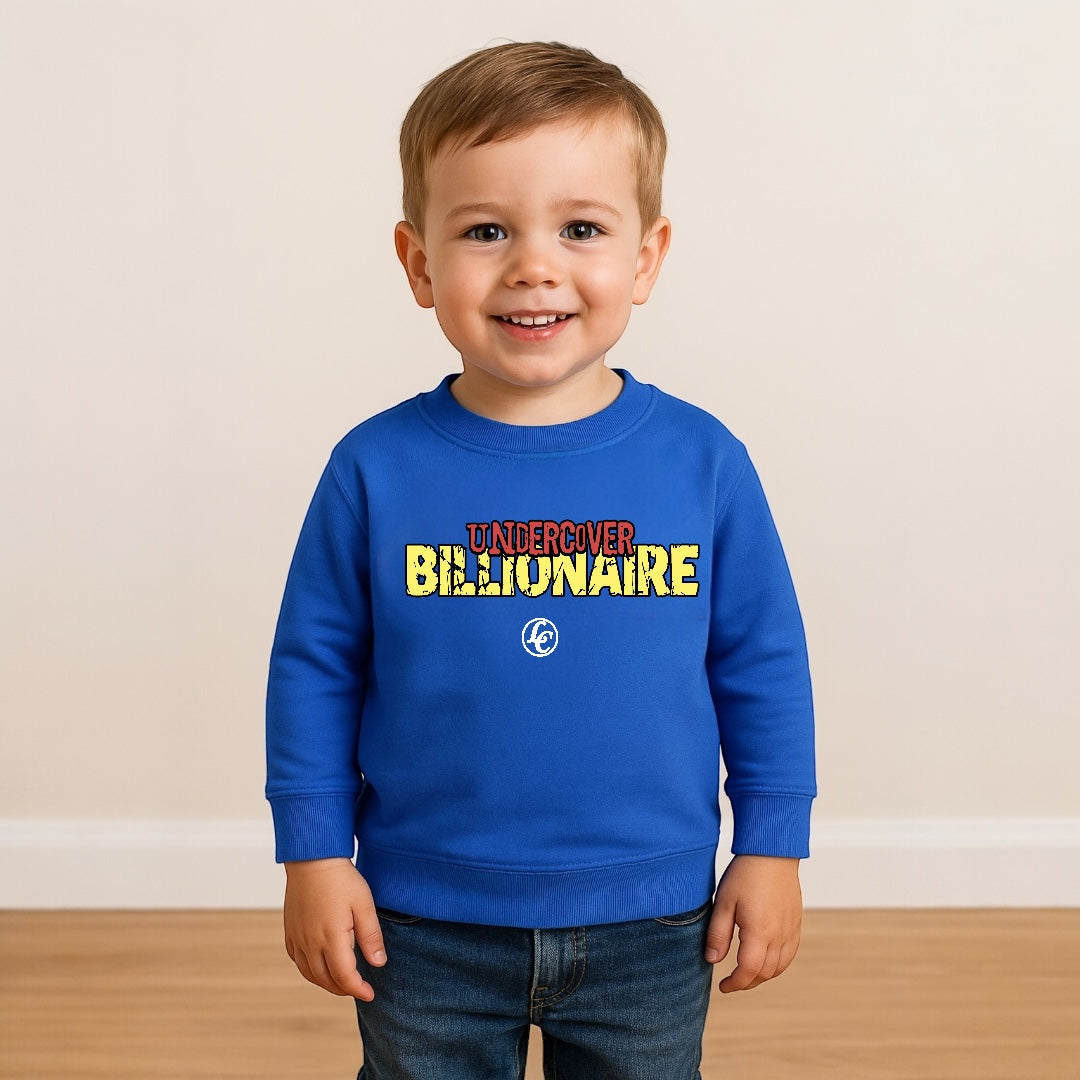 Child wearing a blue sweatshirt with colorful text and logo on a plain background
