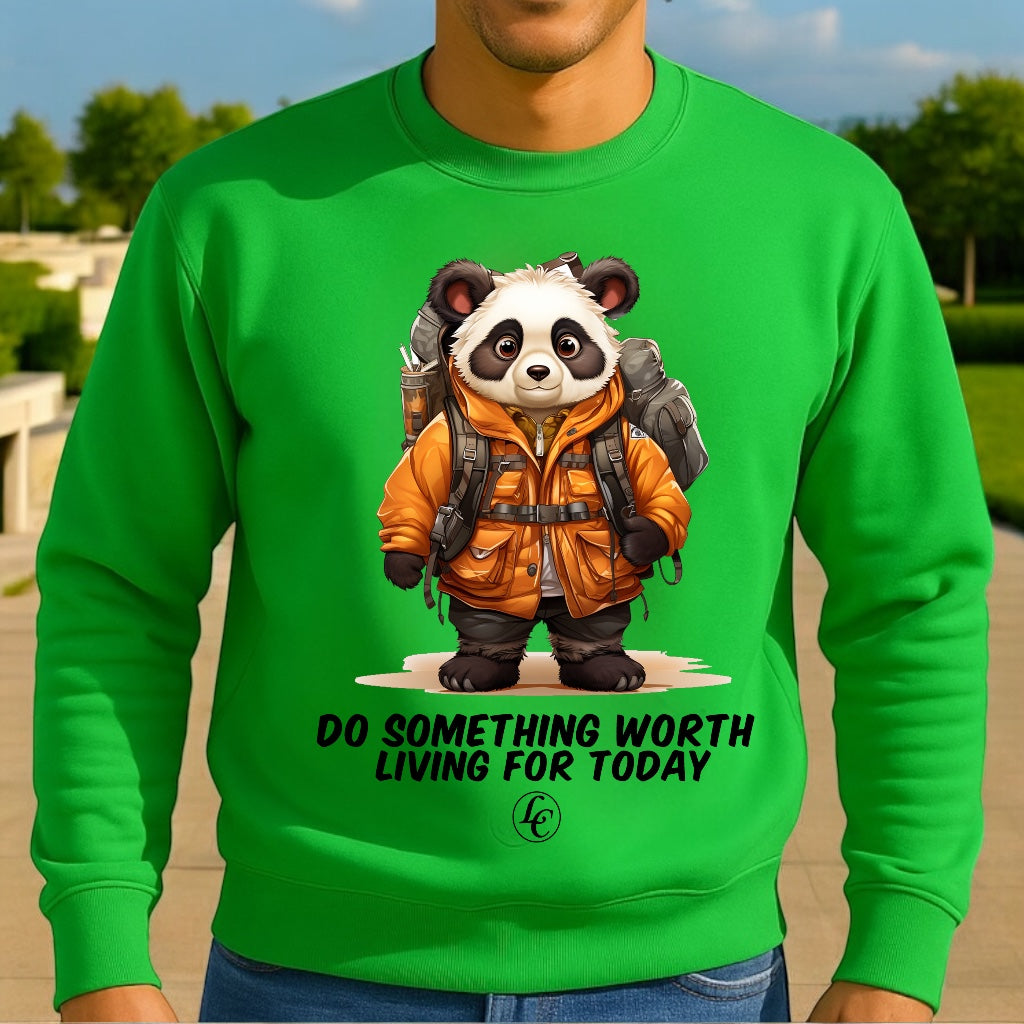 Green sweatshirt with a panda graphic and motivational quote outdoors